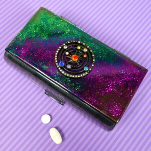 Glittery pink and green 14-dose pill pod box